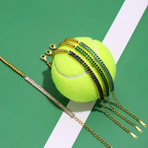 Colorful crystal tennis bracelets wrapped around a tennis ball in a court setting