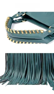 Detail view of the golden woven metal handle and deep teal leather fringe on this stylish bag