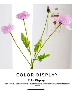 Detail of pink silk poppy flowers with textured petals and green fuzzy stems for decor