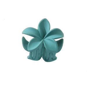 Close-up of a matte green frangipani flower hair claw clip on white background