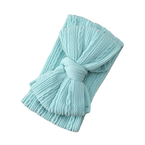 Light blue cable knit baby headband with a large bow detail for newborns and infants