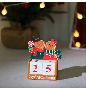 Macro detail of wooden gingerbread couple countdown calendar showing 25 days till Christmas