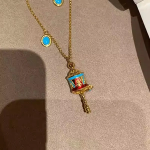 Vintage Tibetan style prayer wheel necklace with colorful enamel inlay on gold chain