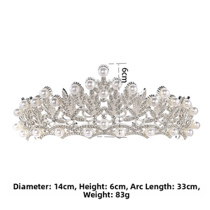 Detailed view of baroque silver tiara with white pearls and dimensions 14x6 cm