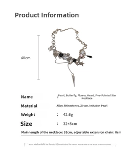Detailed view of necklace with pearls, butterfly and star charms on white background
