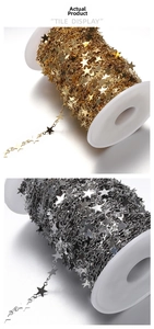 Macro view of 9mm stainless steel star link chain rolls in gold and silver finishes