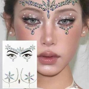 Face and body glitter tattoo stickers with colorful rhinestones on a female model
