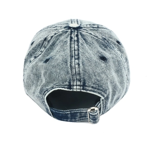 Detail of adjustable silver buckle and vintage acid wash denim texture on baseball cap