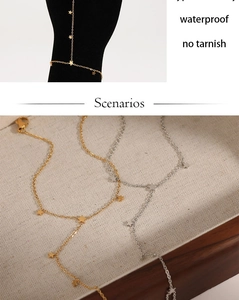 Detailed view of gold and silver star harness bracelets on linen tray and hand