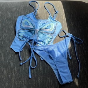Light blue butterfly print two-piece bikini set with side-tie bottoms and ruched top
