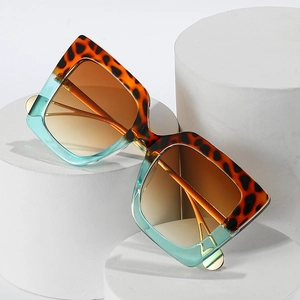 Fashion oversized square sunglasses featuring tortoiseshell and teal blue contrast frame
