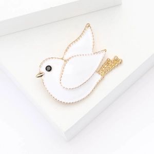 Fashionable alloy enamel pigeon brooch in white and gold with black gemstone eye inlay
