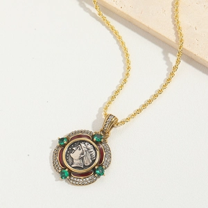 Vintage gold coin pendant necklace with green gems and red enamel on twisted rope chain