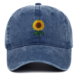 Vintage washed navy blue baseball cap with sunflower embroidery on a plain white background