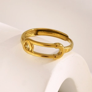 Detailed macro view of an 18K gold-plated safety pin ring with adjustable band
