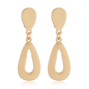 Close-up of golden geometric teardrop earrings with elegant hollow metal design