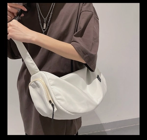 White large capacity sports gym bag shown on a model side profile for travel use