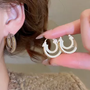18k gold plated double hoop earrings with textured metal inner and smooth resin outer rings