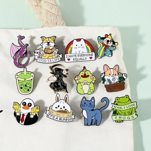 Close-up of 12 creative enamel lapel pins with cartoon animals on white canvas bag