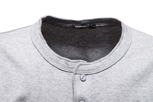 Detail shot of grey cotton Henley neck with two buttons and inner woven size label