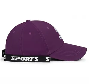 Detail of purple baseball cap featuring a side strap with SPORTS text embroidery