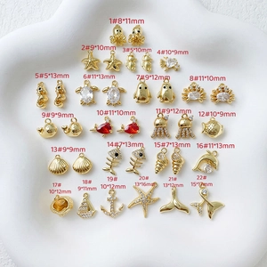 Selection of 22 gold-plated ocean charms with sizes for DIY jewelry crafting and design