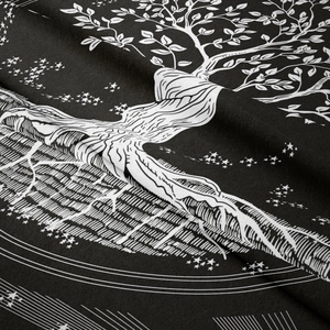 Detailed close-up showing the soft fiber texture and Tree of Life print on the black tapestry