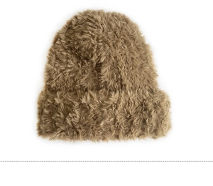 Detail of light brown plush knit beanie showing soft faux fur texture and warmth