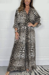 Detailed close-up of leopard print wide-leg jumpsuit with ruffled cuffs and elastic waist