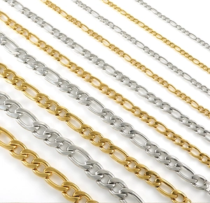 Detail of Figaro chain necklaces in various thicknesses, gold and silver finishes