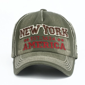 Close-up of olive green distressed cotton cap featuring vintage New York embroidery