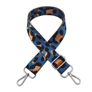 Close-up of leopard jacquard wide shoulder strap with silver metal lobster clasps