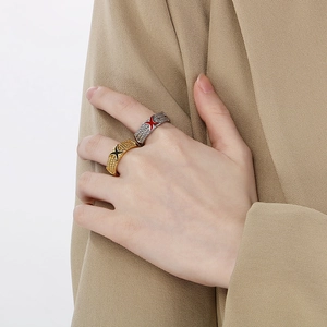Classic braided X-ring with cross star enamel inlay in gold and silver finish