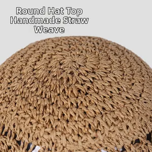 Macro detail of handmade straw woven round hat top showing natural texture