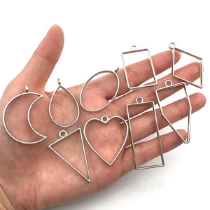 Set of 9 silver geometric alloy hollow open bezels for DIY resin jewelry making