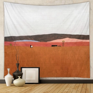 Detail showing a bohemian abstract landscape tapestry on a living room wall