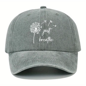 Faded grey washed cotton baseball cap with JUST BREATHE dandelion print