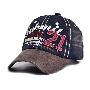 Close-up of vintage embroidered baseball cap with 21 logo and suede brim detail