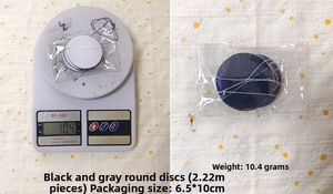 Detail of 2-meter black and grey circle paper garland with weight measurement on scale