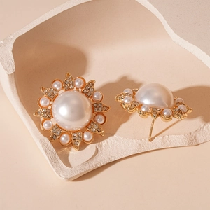 Vintage Baroque sunflower pearl stud earrings with crystal accents in gold finish