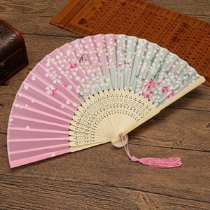 Pink and green gradient silk folding fan with cherry blossoms and a pink tassel