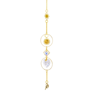 Detail of brass suncatcher featuring celestial moon sun charms and faceted crystal prisms