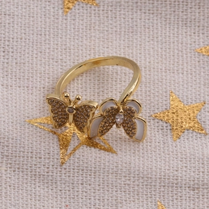 Detailed close-up of a gold-plated adjustable double butterfly ring with sparkling zircons