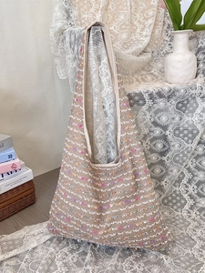 Knit tote bag in beige openwork with colorful accents and spacious shoulder design