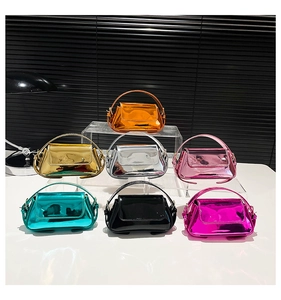 Detailed display of colorful glossy patent leather mini handbags in metallic finishes
