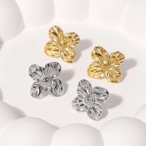 Golden and silver stainless steel flower stud earrings with detailed petal texture