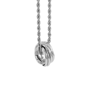 Detail of silver twisted chain necklace with three interlocking metal rings on white background