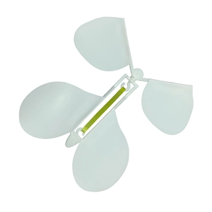 Detailed top view of a white wind-up butterfly toy with a yellow-green rubber band