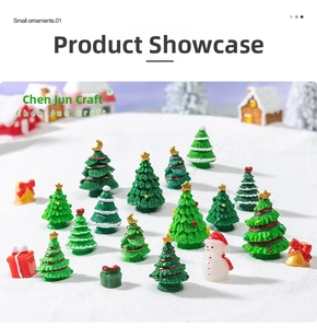Miniature Christmas resin figurine set featuring small snowmen and trees on snow