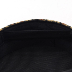 Detail view of the leopard print hat interior with black fabric lining and elastic strap